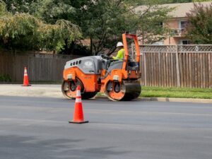 Road repairs construction worker steam roller unsplash